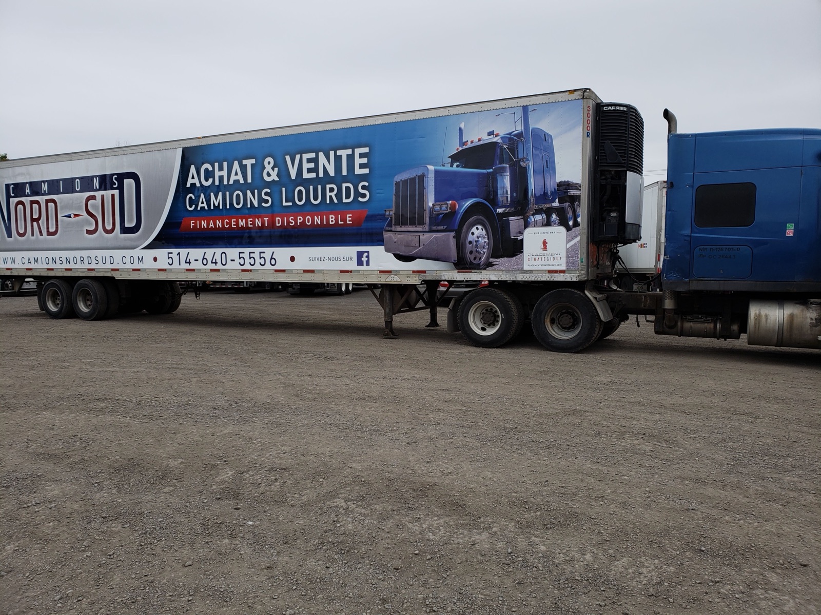 Advertising trailer hitched to a tractor